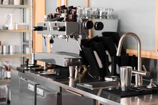 An Innovative Modern Coffee Bar Setup Featuring an Espresso Machine along with Essential Accessories