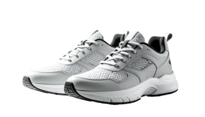 Gray athletic shoes angled, isolated, with mesh panels, laces, and a chunky sole