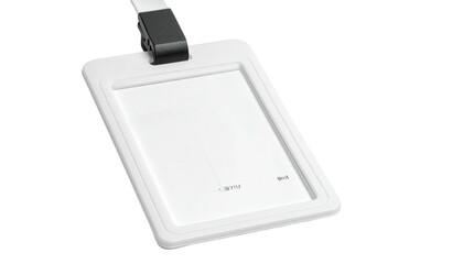Angled shot of a white ID badge with a black clip on a white lanyard