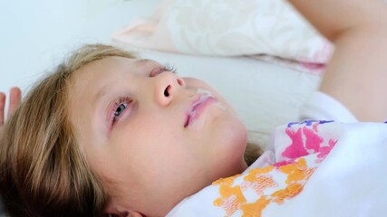 Taking care of a student's sleep. A junior high school student sleeps soundly. Healthy breathing habits in children. A girl with duct tape on her lips for breathing through her nose. Health