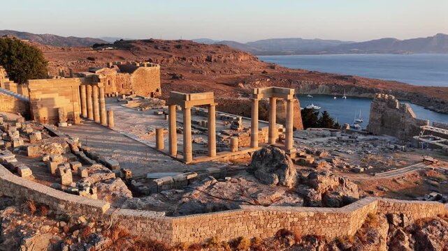 Aerial view of Lindos Acropolis in Rhodes Greece showcasing ancient ruins and stunning coastline