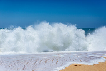 Waves seen from North Beach famous for giant waves in Nazare town on so called Silver Coast, Oeste region of Portugal