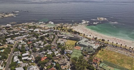 Cape Town South Africa Aerial v80 birds eye view flyover Camps Bay capturing stunning views of the Bakoven residential suburb and the white sandy beach - Shot with Mavic 3 Pro Cine - Jan 11th 2024