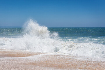 Waves seen from North Beach famous for giant waves in Nazare town on so called Silver Coast, Oeste region of Portugal