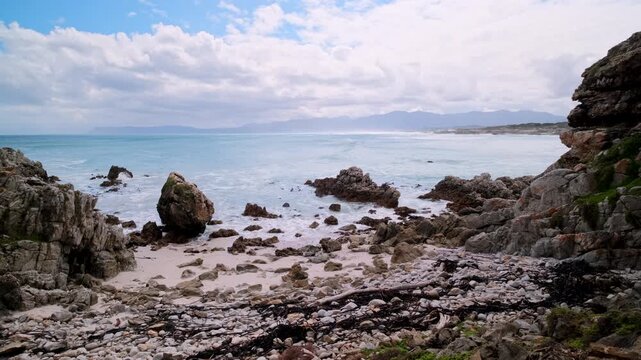 Scenic view over ocean from rocky Walker Bay reserve coastline toward Die Plaat