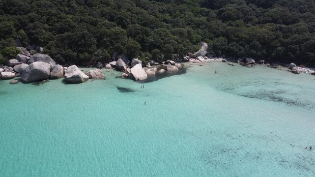 Beautiful rocks in clear water drone shot, Plage de Santa Giulia, Corsica