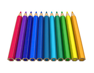 Array of colored pencils, aligned, on black. Varying hues in a rainbow display
