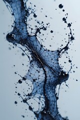 a splash blue ink forming a spider web