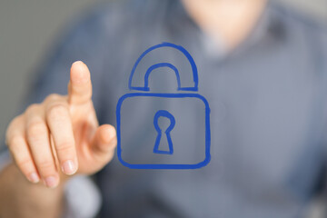 Hand interacting with a glowing blue digital padlock icon, symbolizing cybersecurity, data protection, privacy, and secure online access.