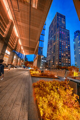 New York City - June 13, 2025: High Line park at Hudson Yards at night showing illuminated pathways and city lights