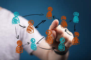 A hand touches a virtual screen displaying an interconnected network of abstract people, representing communication, teamwork, and organizationa