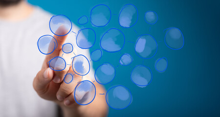 Business hand interacting with a digital network visualization, illustrating connectivity, data...