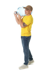 Smiling delivery man with cooler bottle of water on white background