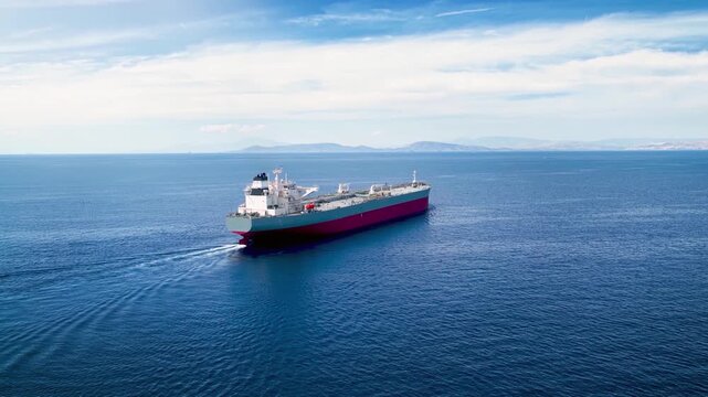 Aerial view of a industrial crude oil or chemical goods tanker sailing over the open ocean