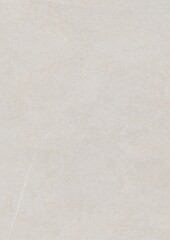 Close-up of a plain light-colored surface with subtle texture and faint markings