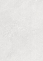 Close-up of a textured white surface with subtle variations in tone and pattern