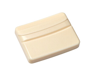 Cream-colored rectangular chocolate confection shaped like a small purse