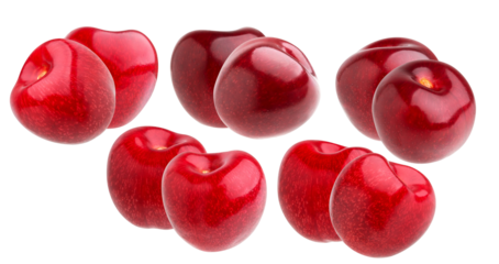 abundant fresh red cherries arranged beautifully on black