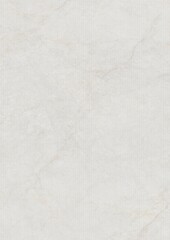 Close-up of a smooth, light-colored marble surface with subtle veining patterns.