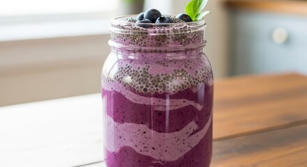 Delicious Blueberry Smoothie with Chia Seeds and Fresh Mint in a Glass Jar.
