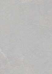 Naklejka premium Close-up view of a smooth, light gray textured surface with subtle variations in tone and faint markings.