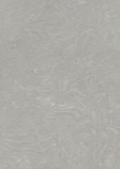 Close-up view of a textured gray surface with subtle wave-like patterns