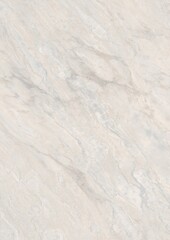 Close-up view of a white marble surface with natural veining patterns
