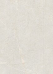 Close-up of a textured light gray surface with subtle stains and faint markings