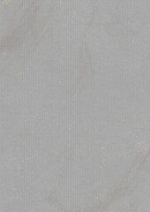 Close-up of a plain light gray textured surface with subtle variations in tone and minor imperfections.