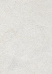 Close-up of a smooth, light-colored marble surface with subtle veining patterns