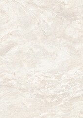 Close-up view of a smooth, light-colored marble surface with subtle veining patterns