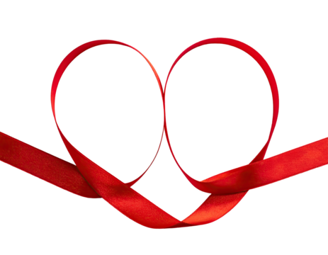 Red ribbon tied in a heart shape against black background