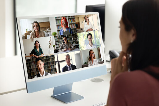 Woman sitting at desk participating in virtual meeting event