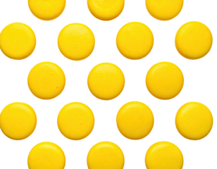 Bright yellow round treats arranged in a honeycomb pattern