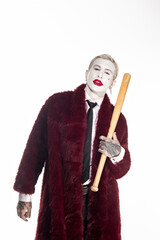 Epic Joker costume shines at Halloween celebration showcasing youth and creativity