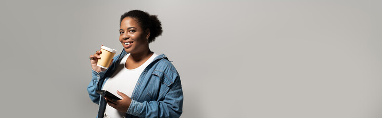 Stylish plus size woman embracing autumn fashion with confidence in studio setting