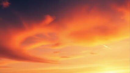 Obraz premium Vibrant sunset sky with dramatic orange and yellow clouds.