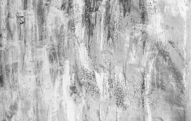 Weathered wall with white peeling paint, showcasing decay, and contrast