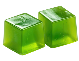 Two vibrant green, square jelly candies, seemingly translucent