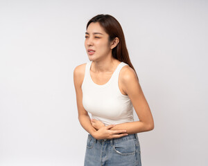 A woman had a stomach ache and gastritis. She put her hand on her stomach and squeezed it to relax and soothe. Unwell unhealthy female menstrual cramps on isolated white background.