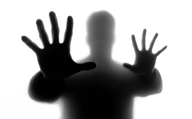 Scary silhouette of person with hands against surface, isolated on transparent cutout background