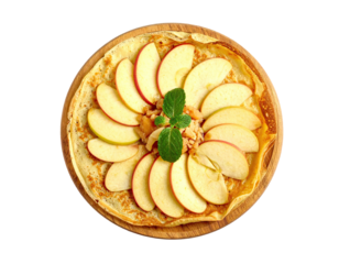 Round crepe topped with sliced apples and mint