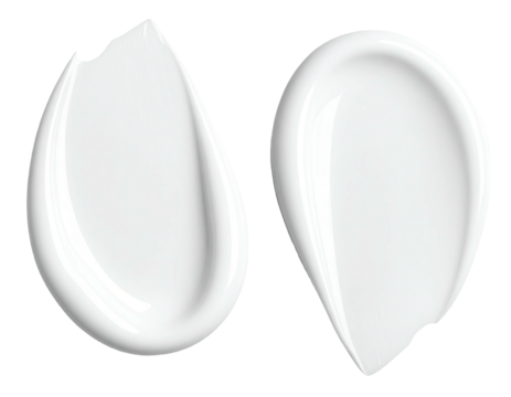 Two smooth, white, cream smears,  like moisturizer or lotion,  isolated on black