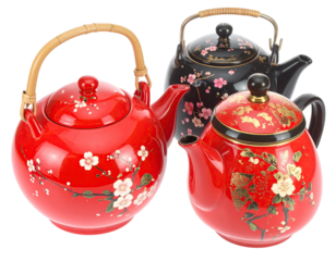 Three red and black ceramic teapots with floral designs and bamboo handles