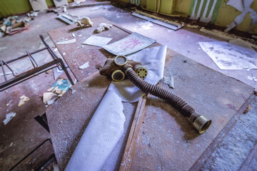 Gas mask in classroom of high school in abandoned military base of Soviet Duga radar, Chernobyl Zone, Ukraine
