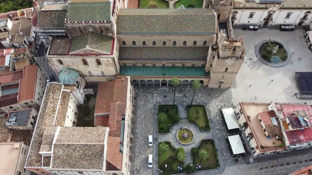 Aerial 4k drone footage of Cattedrale di Monreale in Monreale, Sicily, Italy, showcasing the historic cathedral, city center, surrounding streets, and panoramic views of the town