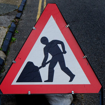 Canterbury, England, UK.Construction worker sign on the street.