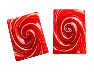 Two red and white swirled hard candies, rectangular shapes, isolated on black