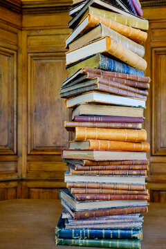 Paris, France, EU. Tall stack of ntique books.
