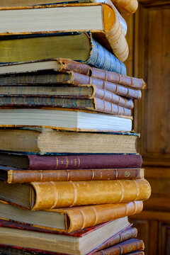 Paris, France, EU. Tall stack of ntique books.